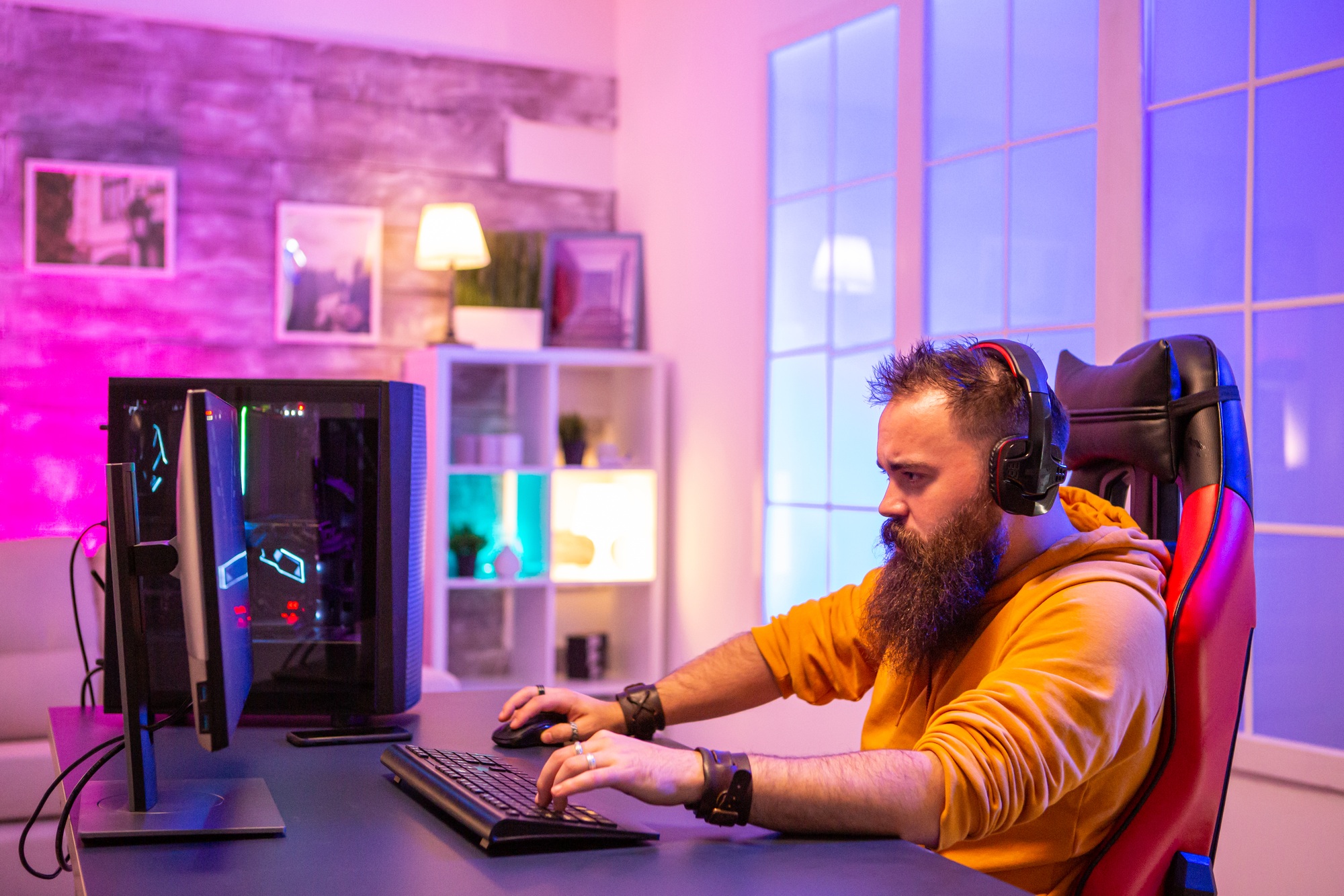 Professional EA sport gamer playing on powerful PC